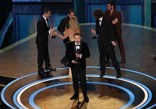 Gints Zilbalodis, Matiss Kaza, Ron Dyens and Gregory Zalcman react as they win the Oscar for Best Animated Feature Film for "Flow" during the Oscars show at the 97th Academy Awards in Hollywood, Los Angeles, California, U.S., March 2, 2025. REUTERS/Carlos Barria