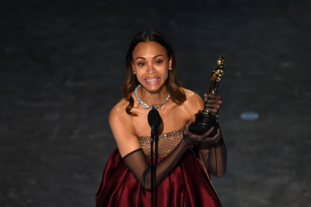 Zoe Saldana accepts the award for Best Actress in a Supporting Role for "Emilia Perez" onstage during the 97th Annual Academy Awards at the Dolby Theatre in Hollywood, California on March 2, 2025. 