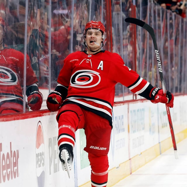 Carolina Hurricanes' Sebastian Aho celebrates after his winning overtime goal against the Calgary Flames in an NHL hockey game in Raleigh, N.C., Sunday, March 2, 2025. (AP Photo/Karl DeBlaker)