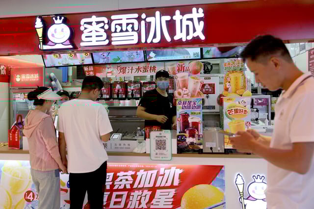 Customers wait at a Mixue Bingcheng bubble tea store at a shopping mall in Beijing, China last year. REUTERS/Florence Lo/File Photo