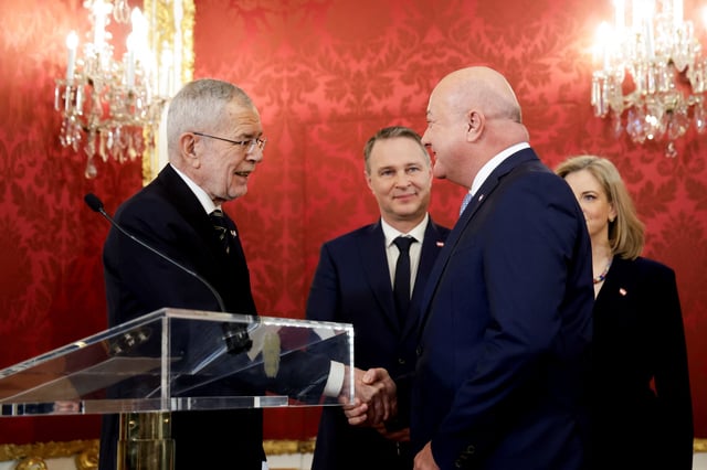 Austria's President Alexander Van der Bellen shakes hands with head of People's Party (OeVP) and the new Chancellor Christian Stocker during the swearing-in ceremony of a new government at Hofburg Palace in Vienna, Austria, March 3, 2025. REUTERS/Leonhard Foeger