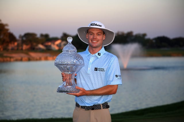 PALM BEACH GARDENS, FLORIDA - MARCH 02: Joe Highsmith of the United States poses with the trophy after putting in to win on the 18th green during the final round of the Cognizant Classic in The Palm Beaches 2025 at PGA National Resort And Spa on March 02, 2025 in Palm Beach Gardens, Florida. (Photo by Mike Ehrmann/Getty Images)