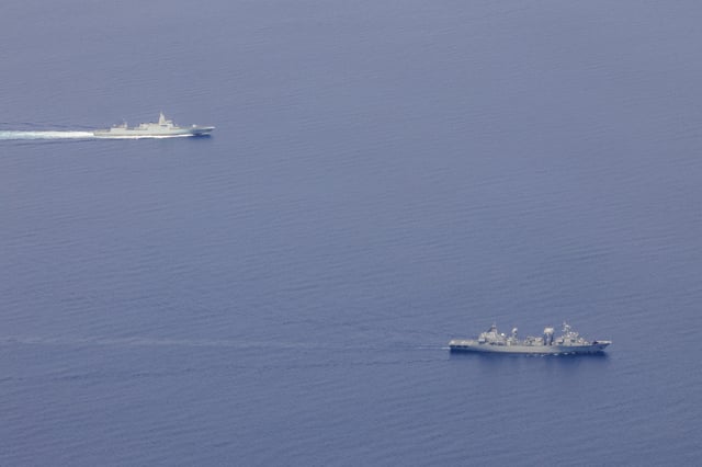 In this photo provided by the Australian Defense Force on February 11, 2025, the Chinese destroyer CNS Zunyi, top, and replenishment ship CNS Weishanhu transit toward the Coral Sea northeast of Australia.