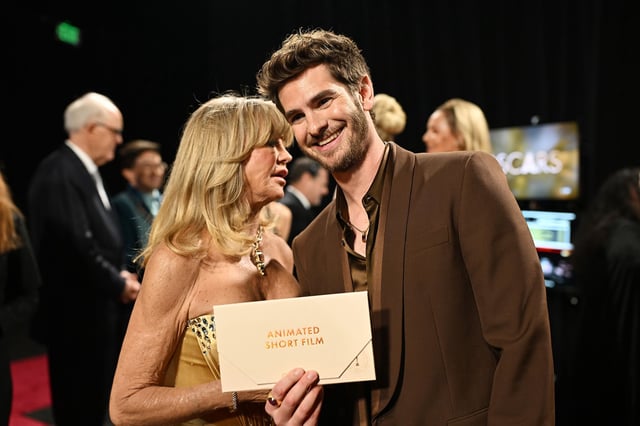 Goldie Hawn (left) and Andrew Garfield (right) pictured backstage at the Oscars.