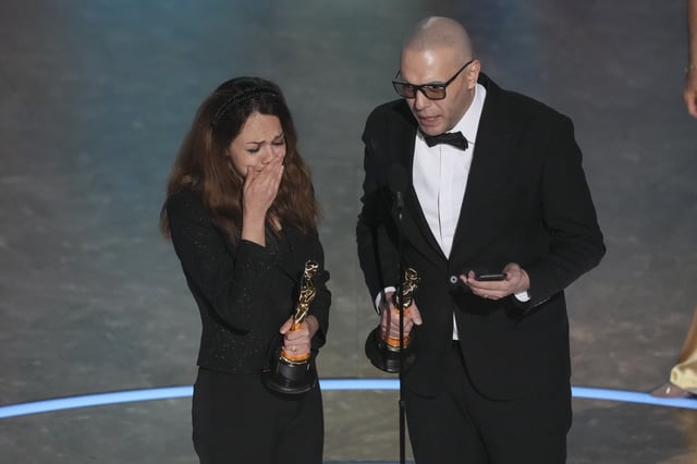 Shirin Sohani, left, and Hossein Molayemi accept the award for best animated short for &#34;In the Shadow of the Cypress&#34; during the Oscars on Sunday, March 2, 2025, at the Dolby Theatre in Los Angeles.