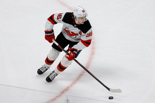 Feb 26, 2025; Denver, Colorado, USA; New Jersey Devils center Jack Hughes (86) controls the puck in the first period against the Colorado Avalanche at Ball Arena. Mandatory Credit: Isaiah J. Downing-Imagn Images/File Photo