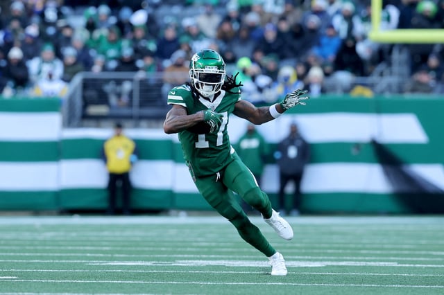 Dec 22, 2024; East Rutherford, New Jersey, USA; New York Jets wide receiver Davante Adams (17) runs with the ball against the Los Angeles Rams during the second quarter at MetLife Stadium. Mandatory Credit: Brad Penner-Imagn Images/File Photo