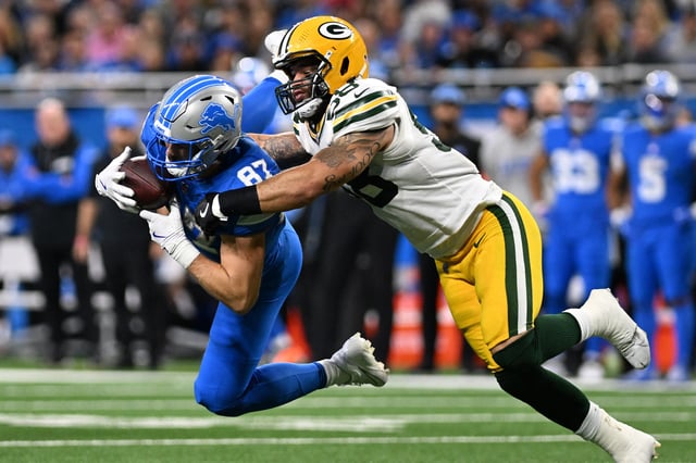 Dec 5, 2024; Detroit, Michigan, USA;  Detroit Lions tight end Sam LaPorta (87) makes a leaping catch in front of Green Bay Packers linebacker Isaiah McDuffie (58) in the fourth quarter at Ford Field. Mandatory Credit: Lon Horwedel-Imagn Images/File Photo