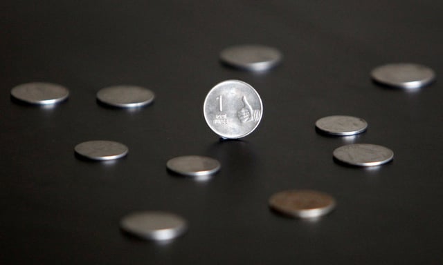 An Indian one rupee coin is seen in this picture illustration taken in Mumbai April 30, 2012. REUTERS/Vivek Prakash/File Photo
