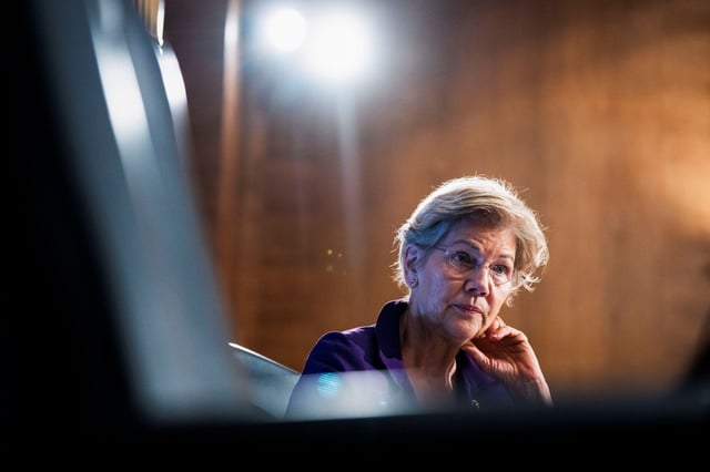 U.S. Senator Elizabeth Warren (D-MA) listens as Federal Reserve Chairman Jerome Powell testifies during the Senate Banking Committee hearing titled "The Semiannual Monetary Policy Report to the Congress", in Washington, U.S., March 3, 2022.  Tom Williams/Pool via REUTERS