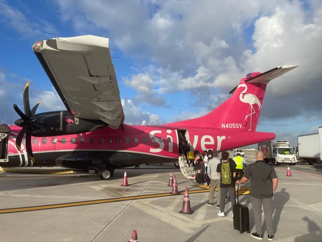 Travelers line up to get into a Silver Airways plane at Fort Lauderdale-Hollywood International Airport on Nov. 1, 2024. (Juan Ortega/South Florida Sun Sentinel)