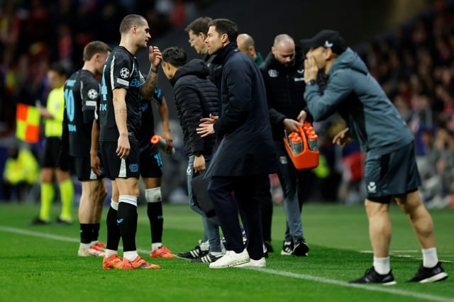Bayer Leverkusen coach Xabi Alonso talks with midfielder Granit Xhaka