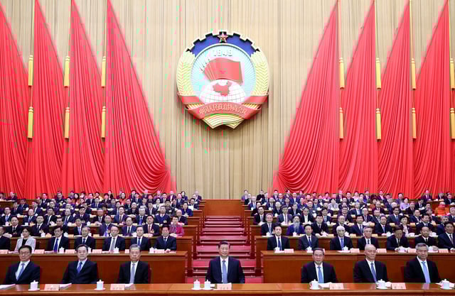 Chinese leader Xi Jinping, center, attends a meeting at Beijing's Great Hall of the People during China's annual "two sessions" political gathering last March.