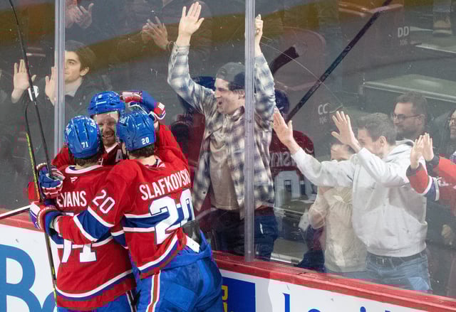 Montreal Canadiens' Mike Matheson (8) celebrates his winning goal over Buffalo Sabres with teammates Jake Evans (71) and Juraj Slafkovsky (20) during NHL overtime hockey action in Montreal on Monday, March 3, 2025. 