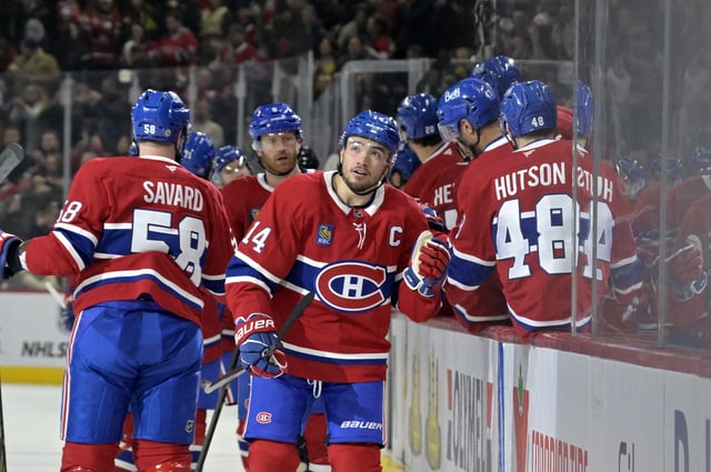 Mar 3, 2025; Montreal, Quebec, CAN; Montreal Canadiens forward Nick Suzuki (14) celebrates with teammates after scoring a goal against the Buffalo Sabres during the first period at the Bell Centre. Mandatory Credit: Eric Bolte-Imagn Images