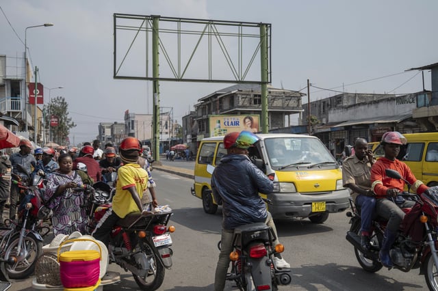 Moto taxis wait for customers in downtown Goma, Democratic Republic of Congo, Thursday, Feb. 27, 2025, one month after Rwanda-backed M23 rebels captured the city. (AP Photo/Moses Sawasawa)