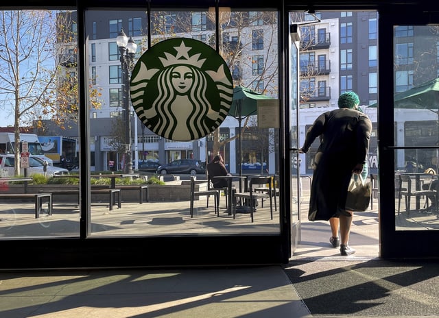 FILE - A customer exits a Starbucks store in Oakland, Calif., Jan. 16, 2025. (AP Photo/Godofredo A. Vásquez, File)