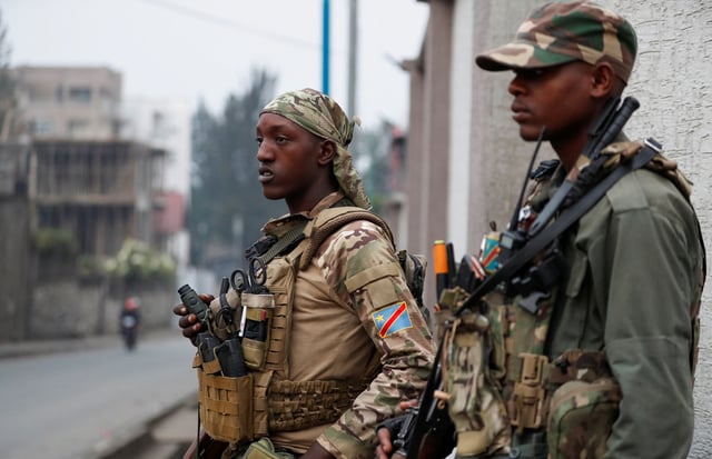 Members of the M23 rebel group stand guard, outside, at their position amid conflict between them and the Armed Forces of the Democratic Republic of the Congo (FARDC), in Goma, eastern Democratic Republic of the Congo, January 29, 2025. REUTERS/Stringer/File Photo