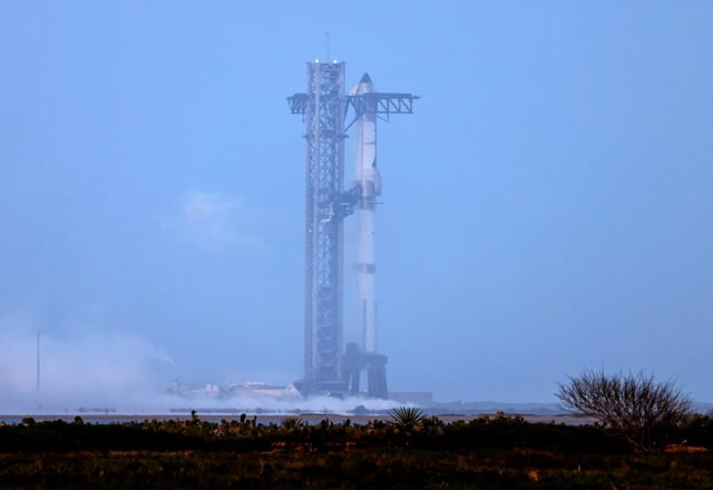 SpaceX's next-generation Starship spacecraft atop its powerful Super Heavy rocket is pictured after the company opted to delay of its eighth test flight from the Boca Chica launch pad in Brownsville, Texas.