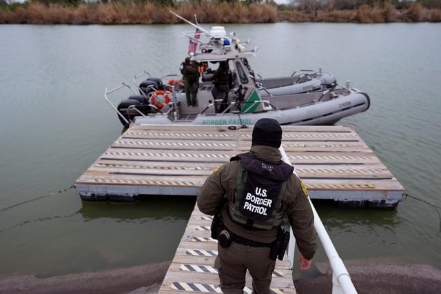Border patrol agents prepare to board boats to patrol along the Rio Grande at the U.S.-Texas border. The U.S. Border Patrol recorded just 8,326 Southwest border encounters in February, lowest for a month in history. (AP Photo/Eric Gay)