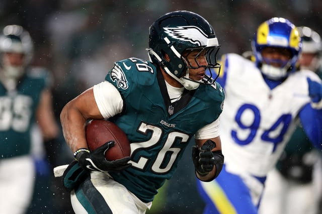 Saquon Barkley #26 of the Philadelphia Eagles runs the ball against the Los Angeles Rams during the second quarter in the NFC Divisional Playoff at Lincoln Financial Field on January 19, 2025 in Philadelphia, Pennsylvania. 