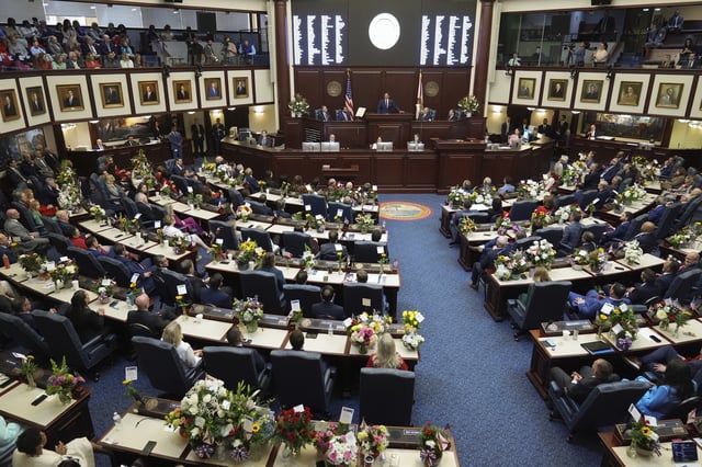 Florida Gov. Ron DeSantis, center, gives his State of the State address to a joint session on the opening day of the 2025 legislative session, Tuesday, March 4, 2025, at the state capitol in Tallahassee, Fla. (AP Photo/Rebecca Blackwell)
