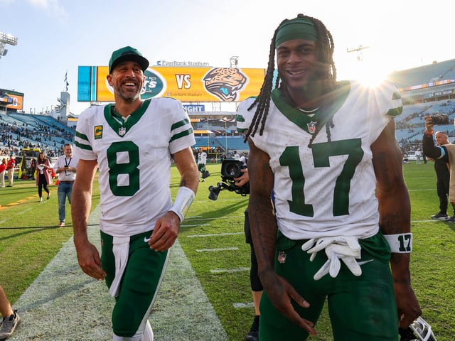 Dec 15, 2024; Jacksonville, Florida, USA; New York Jets quarterback Aaron Rodgers (8) and wide receiver Davante Adams (17) celebrates after beating the Jacksonville Jaguars at EverBank Stadium. Mandatory Credit: Nathan Ray Seebeck-Imagn Images