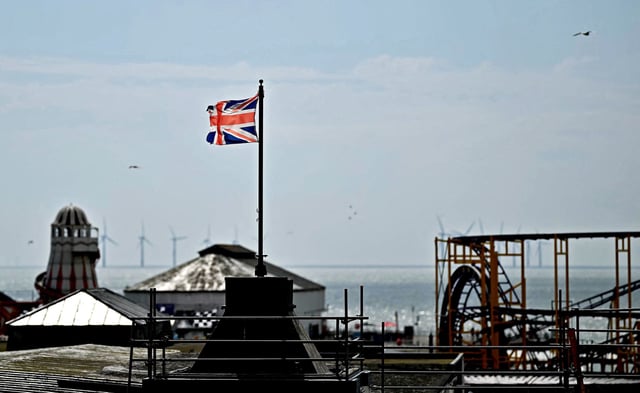 A Union Jack flag flies from a pole above Clacton Pier in Clacton-on-Sea, eastern England, on June 4, 2024.