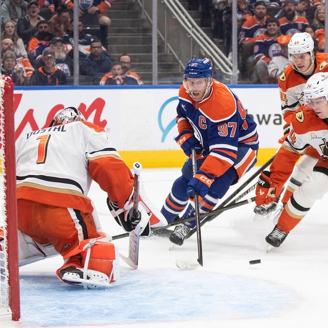 Anaheim Ducks goalie Lukas Dostal (1) makes the save on Edmonton Oilers' Connor McDavid (97) as Pavel Mintyukov (34) defends during second period NHL action in Edmonton on Tuesday, March 4, 2025. THE CANADIAN PRESS/Jason Franson