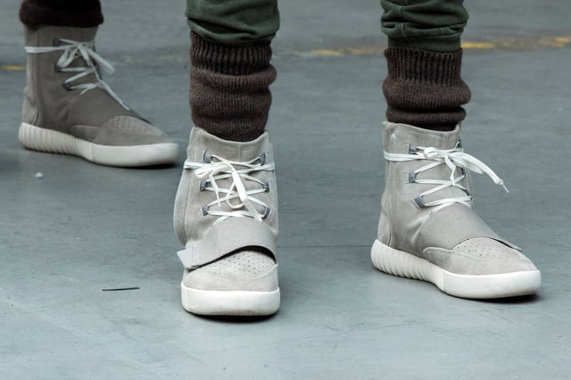 A model wears a pair of Adidas Yeezy 750 Boost shoes designed by Kanye West as part of his Fall/Winter 2015 partnership line with Adidas at New York Fashion Week February 12, 2015. REUTERS/Lucas Jackson/File Photo