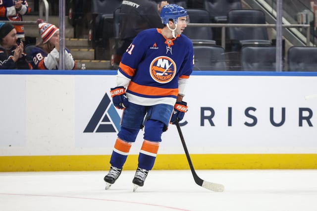 Mar 4, 2025; Elmont, New York, USA;  New York Islanders center Kyle Palmieri (21) circles back to center ice after scoring a goal in the first period against the Winnipeg Jets at UBS Arena. Mandatory Credit: Wendell Cruz-Imagn Images
