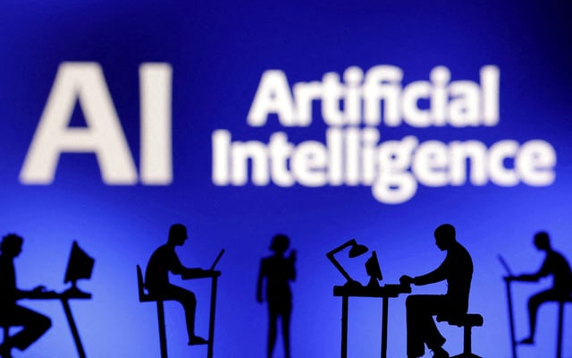 Figurines with computers and smartphones are seen in front of the words "Artificial Intelligence AI" in this illustration taken, February 19, 2024. REUTERS/Dado Ruvic/Illustration/File Photo