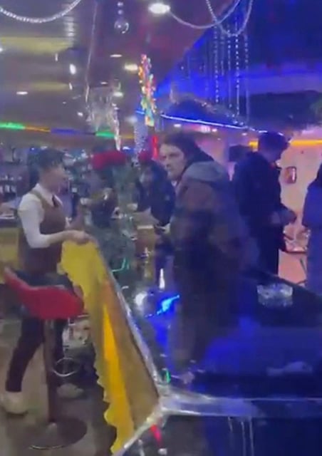 Tourists order drinks at a bar in Rason, North Korea, on February 20. Photo: Koryo Tours via AP