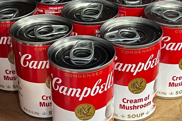 Cans of Campbell's cream of mushroom soup line a supermarket shelf in Bellingham, Washington, U.S. April 25, 2024.  REUTERS/Chris Helgren/File Photo