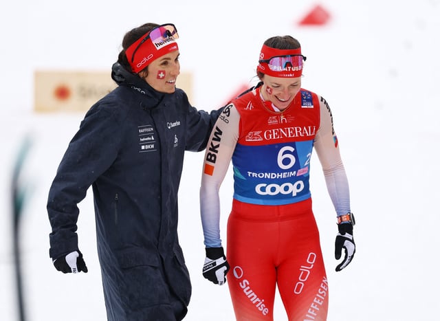 Nordic Skiing - FIS Nordic World Ski Championships - Trondheim, Norway - March 5, 2025 Switzerland's Anja Weber and Switzerland's Nadine Faehndrich react after finishing third in the women's team sprint classic REUTERS/Kai Pfaffenbach