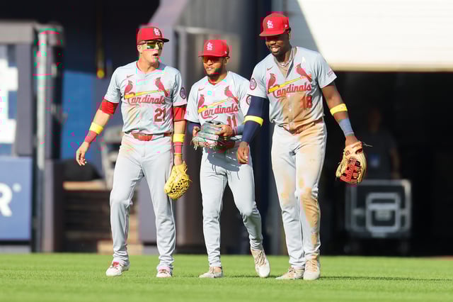 Jordan Walker #18, Victor Scott II #11 and Lars Nootbaar #21 of the St. Louis Cardinals celebrate after defeating the New York Yankees 14-7 at Yankee Stadium on September 01, 2024 in New York City.