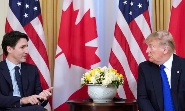 U.S. President Donald Trump and Canada's Prime Minister Justin Trudeau hold a meeting ahead of the NATO summit in Watford, in London, Britain, December 3, 2019. REUTERS/Kevin Lamarque/File Photo