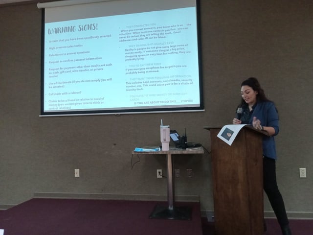 In Canton, Ohio, Det. Danielle Paciorek explains the warning signs of fraud at a lunch-and-learn session for seniors sponsored by the Perry Police Department at the Canton McKinley Fraternal Order of Eagles in September 2024.