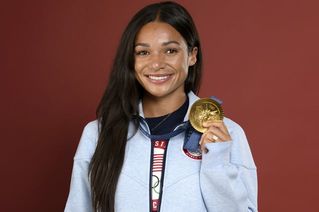 Olympian Sophia Smith poses with her gold medal in Paris.