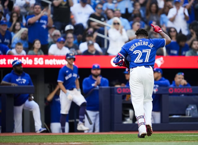 TORONTO, ON - SEPTEMBER 29: Vladimir Guerrero Jr. #27 of the Toronto Blue Jays salutes the crowd while coming out of the game after drawing a walk for his last at bat of the season, against the Miami Marlins, in their MLB game at the Rogers Centre on September 29, 2024 in Toronto, Ontario, Canada.