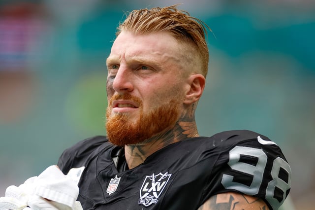 MIAMI GARDENS, FLORIDA - NOVEMBER 17: Maxx Crosby #98 of the Las Vegas Raiders on the sideline during the first half against the Miami Dolphins at Hard Rock Stadium on November 17, 2024 in Miami Gardens, Florida.