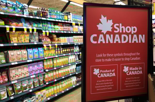 A sign indicating shoppers can Shop Canadian is pictured inside a Save-On-Foods grocery store in Victoria, British Columbia on March 3, 2025. THE CANADIAN PRESS IMAGES/Don Denton