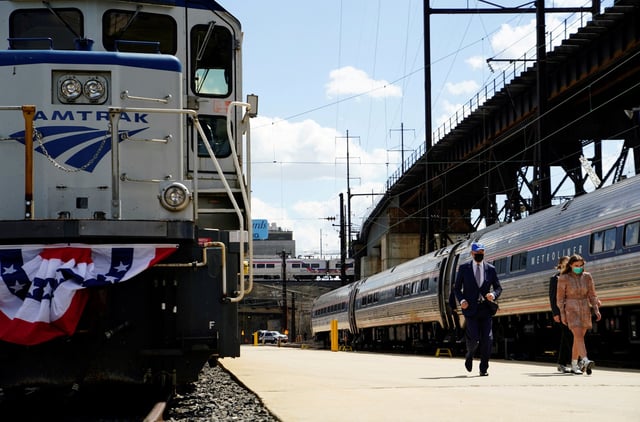 U.S. President Joe Biden arrives with his granddaughters Finnegan and Maisy for an event marking Amtrak's 50th Anniversary, at the 30th Street Station in Philadelphia, Pennsylvania, U.S., April 30, 2021.