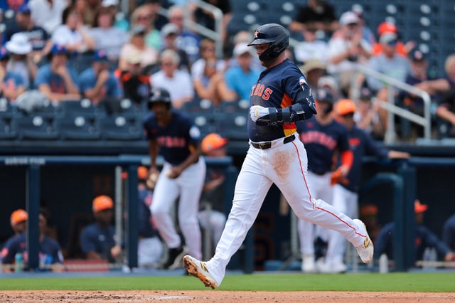Feb 25, 2025; West Palm Beach, Florida, USA; Houston Astros first baseman Christian Walker (8) scores against the New York Mets during the first inning at CACTI Park of the Palm Beaches. Mandatory Credit: Sam Navarro-Imagn Images/File Photo
