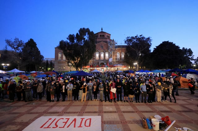 Members of UCLA faculty stand on the frontlines as protesters stand together in the encampment after they were asked to leave by UCLA campus police, during a protest in support of Palestinians in Gaza, at the University of California Los Angeles (UCLA), as the conflict between Israel and the Palestinian Islamist group Hamas continues, in Los Angeles, California, U.S., May 1, 2024. REUTERS/David Swanson/File Photo