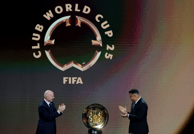 Soccer Football - Club World Cup - Draw - Miami, Florida, United States - December 5, 2024 FIFA president Gianni Infantino and Ronaldo unveil the trophy before the draw REUTERS/Brian Snyder/File Photo