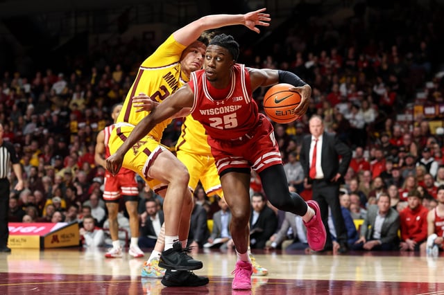 Mar 5, 2025; Minneapolis, Minnesota, USA; Wisconsin Badgers guard John Blackwell (25) works around Minnesota Golden Gophers guard Lu'Cye Patterson (25) during the second half at Williams Arena. Mandatory Credit: Matt Krohn-Imagn Images