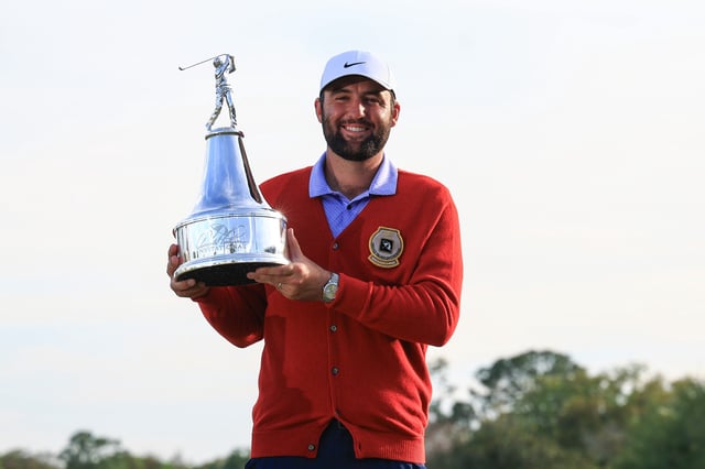 ORLANDO, FLORIDA - MARCH 10: Scottie Scheffler of the United States poses with the trophy after winning the Arnold Palmer Invitational presented by Mastercard at Arnold Palmer Bay Hill Golf Course on March 10, 2024 in Orlando, Florida.