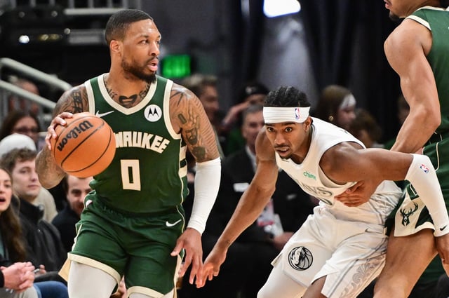 Mar 5, 2025; Milwaukee, Wisconsin, USA; Milwaukee Bucks guard Damian Lillard (0) drives for the basket against Dallas Mavericks guard Brandon Williams (10) in the third quarter at Fiserv Forum. Mandatory Credit: Benny Sieu-Imagn Images