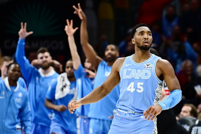 Mar 5, 2025; Cleveland, Ohio, USA; Cleveland Cavaliers guard Donovan Mitchell (45) celebrates after hitting a three point basket during the second half against the Miami Heat at Rocket Arena. Mandatory Credit: Ken Blaze-Imagn Images